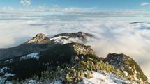Epic winter morning above clouds in foggy mountains time lapse
