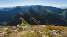 Beautiful view of green alps mountains trail in sunny morning nature background
