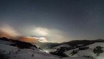 Winter night sky with stars and moon light Time lapse
