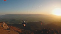 Evening paragliding flight over autumn mountains nature, freedom adrenaline adventure, free like a bird
