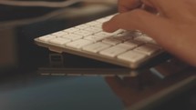 person typing on a keyboard 