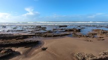Panoramic view of empty beach in sunny summer day in Morocco ocean coast

