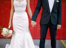 torso of a bride and groom