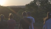 teens on a hike at sunset 