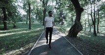 man walking through a park 