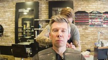 man getting his hair styled 