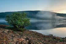 steam over a lake at sunrise 