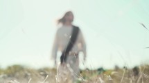 Jesus walking through a field 