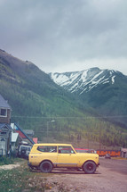 old cars parked on a gravel road in Silverton 