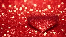 Valentines Day Background with glittering hearts. Big glitter red heart.