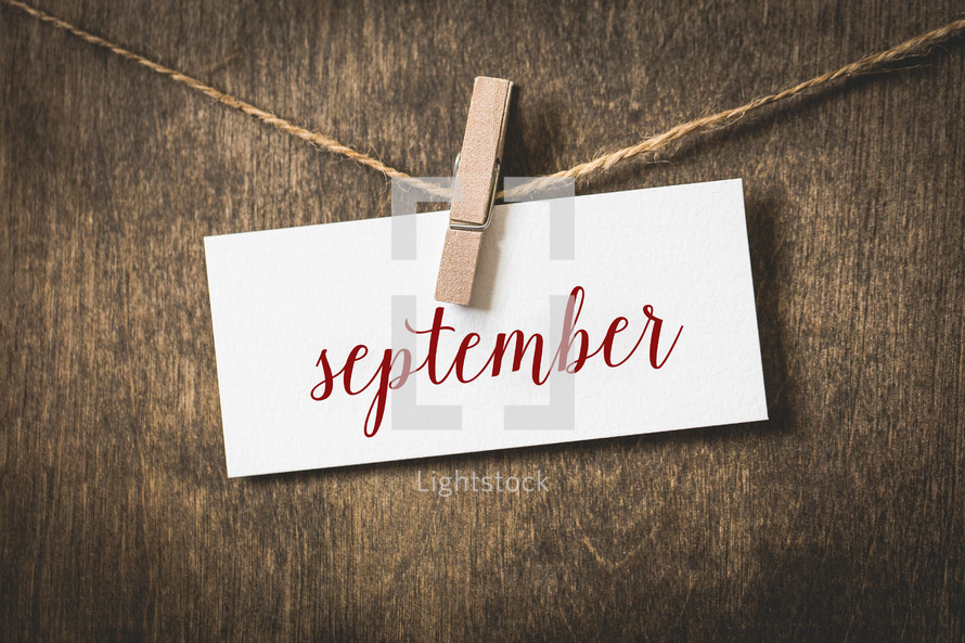 word September hanging on a clothesline 
