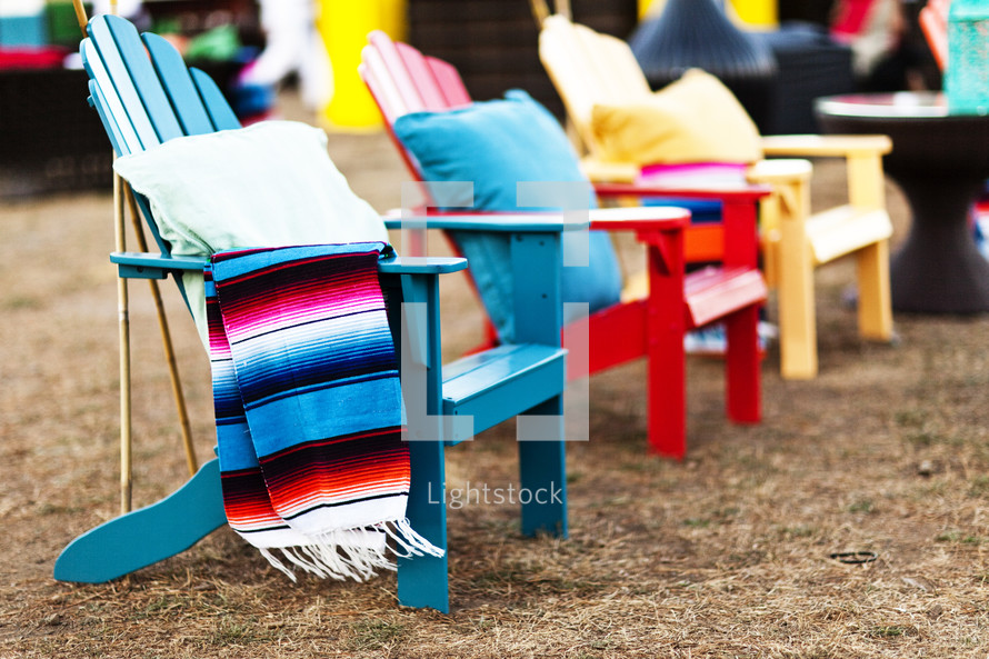colorful Adirondack chair beach red blue yellow row