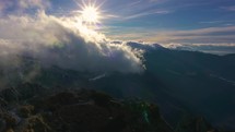 Clouds motion fast over mountains in sunny morning nature Time lapse