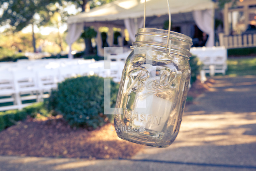 mason jar hanging outside house in the country