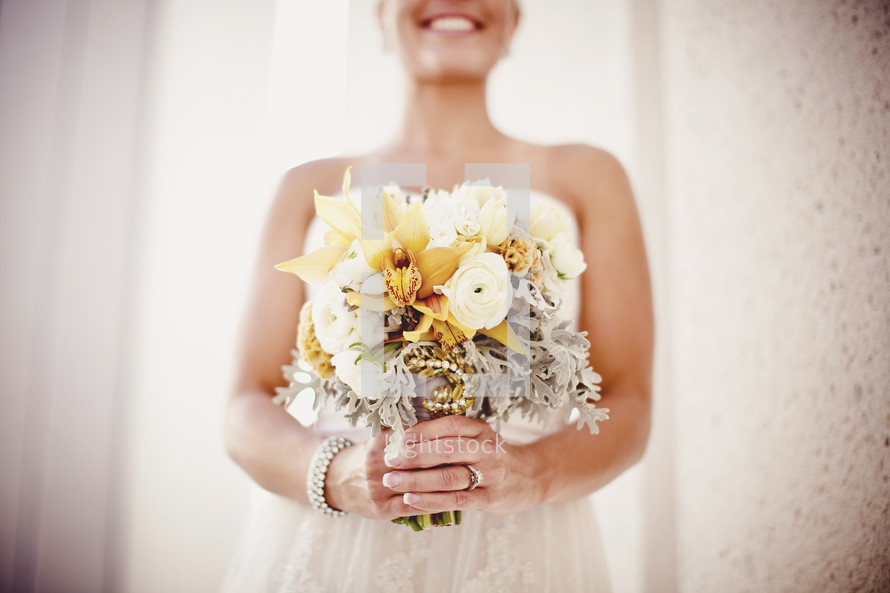 A bride shows off her bouquet