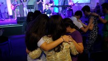 group praying together at a worship service 