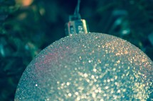 a silver glittery Christmas ornament 