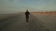 man running on a beach 