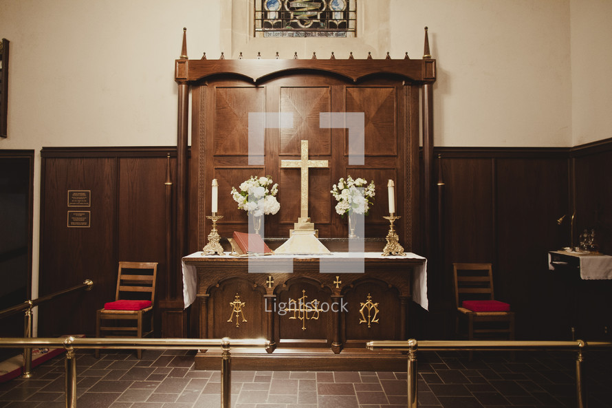 A Church altar with Cross and candles
