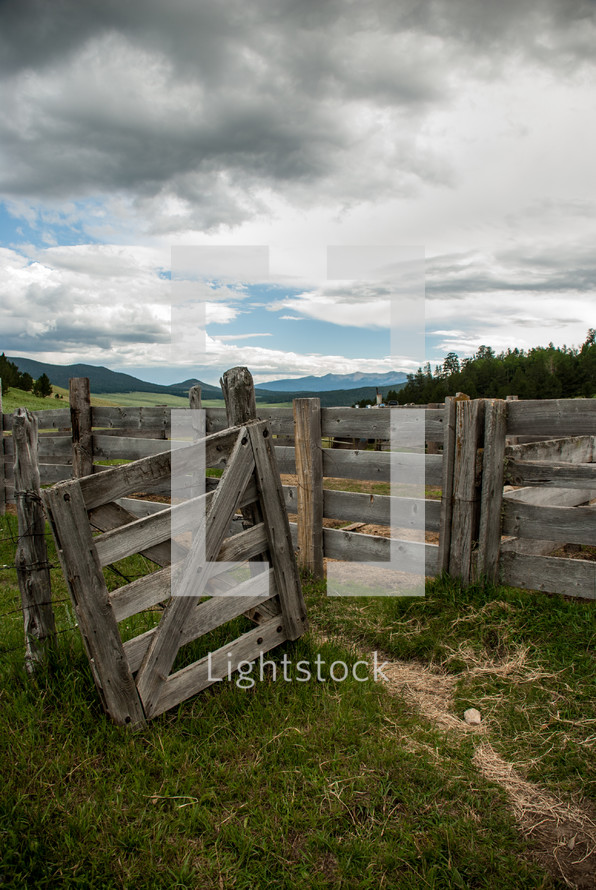 wooden fence and gate on farmland 