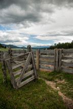 wooden fence and gate on farmland 