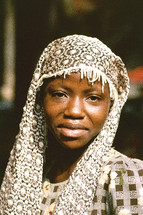 African woman shrouded in lace 