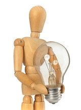 Wooden dummy that maintains a light bulb in hand on white background