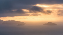 Panoramic shot of colorful morning over small islands in ocean coast Time lapse