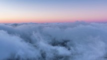 Colorful evening above clouds heaven background in peaceful nature Time-lapse
