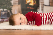 infant boy in Christmas pajamas 
