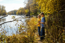 boys exploring a riverbank 