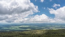 Panorama view of green sunny nature in New Zealand with white clouds in blue sky Time-lapse

