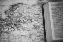 Bible on a map of Europe, missions preparation 