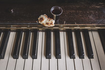 wine and bread on piano for communion service