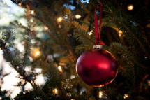 Christmas ornaments on a decorated Christmas tree. 