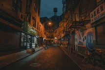 narrow city street at night 