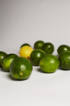 One lemon among a group of limes