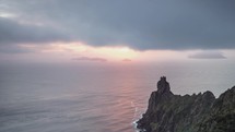 Beautiful colors of sunrise over rocky ocean coast in New Zealand wild nature mountains Time lapse
