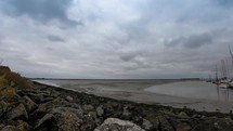 Wide angle timelapse on a cloudy day on the Harbor of Langeoog island, Germany