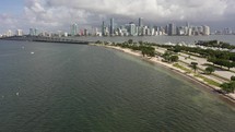 Cinematic daytime aerial reveal of  a bridge and city skyline in Miami in 4k