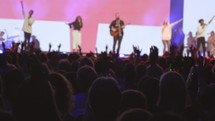 cheering fans at a Christian music concert 