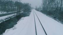 train traveling through snow 