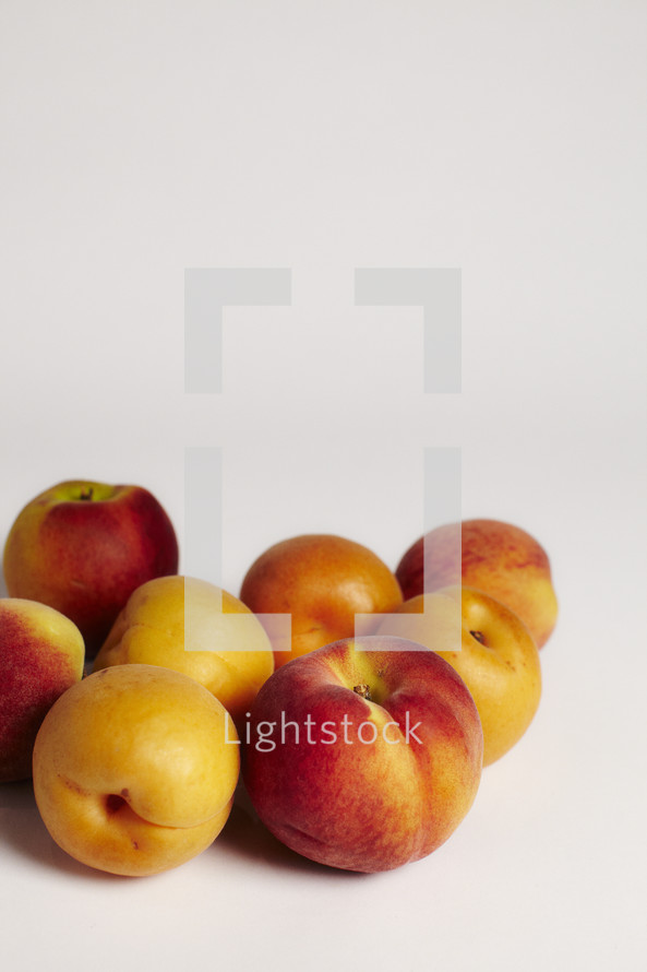 Group of peaches isolated on white