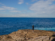 a woman with binoculars overlooking Nelson Bay 