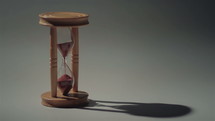Isolated sand clock with space for text. Dolly shot.