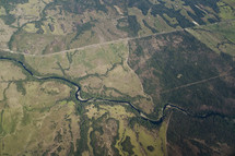An aerial view of a river cutting through the land