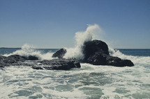Waves crashing on the rocks in the ocean