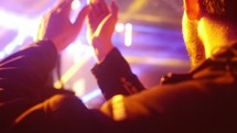 clapping hands at a concert 
