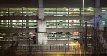Timelapse of traffic near parking deck at night