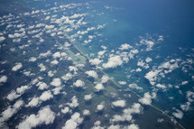 Aerial view of clouds and landscape.